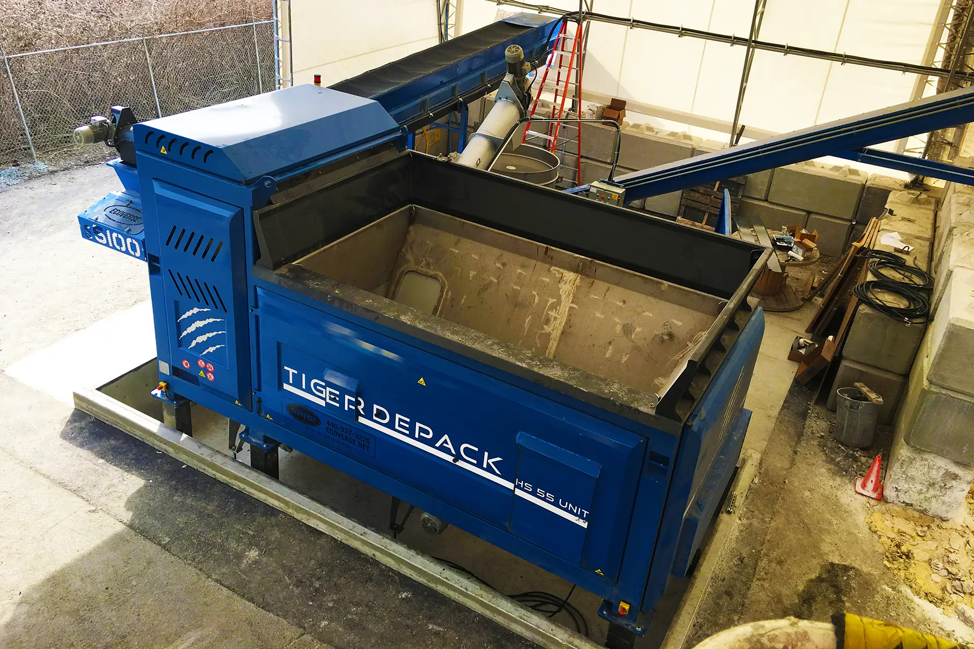 An aerial view, showing the hopper of the Tiger Depack HS-55 waste food processing machine.