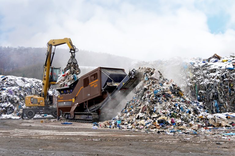 A CoreShred 900 twin-shaft shredder is processing large volumes of municipal solid waste and had created a large pile.