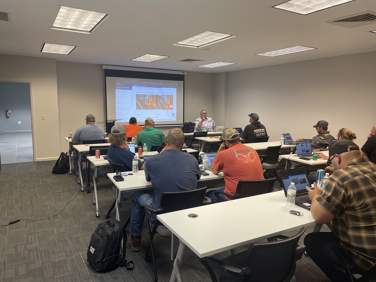 The Training Room in the Ecoverse Product Support Center shows a Doppstadt Factory trainer leading a session on trommel service.