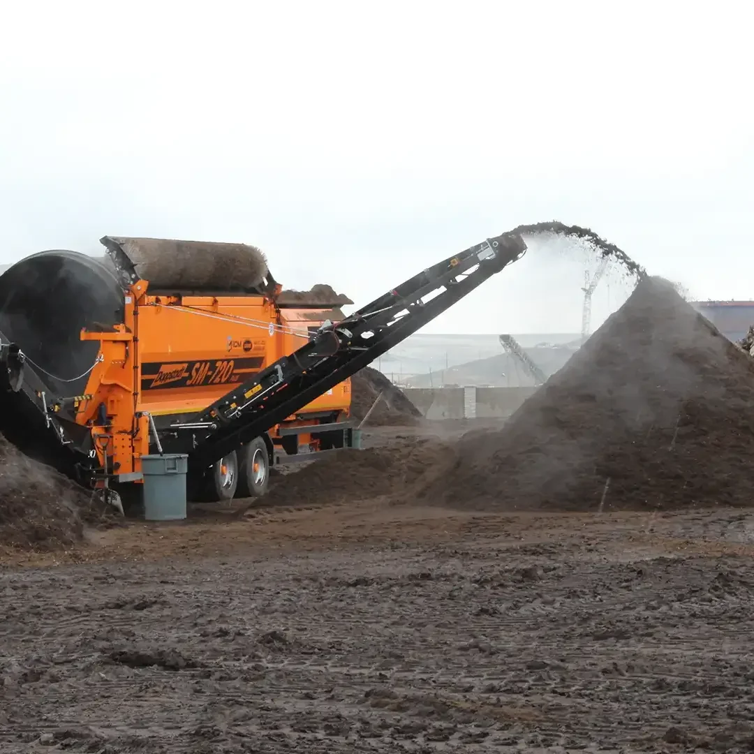A trommel screen separates mulch into different sized piles so it can be sold.